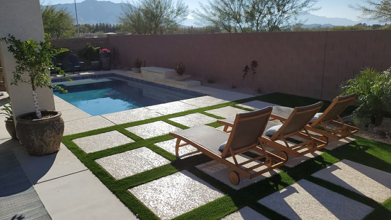 Elegant backyard with turf and pavers